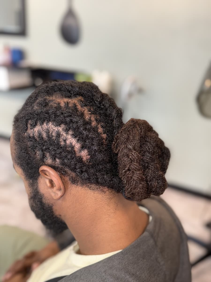 Men's loc style — low bun with neat retwist
