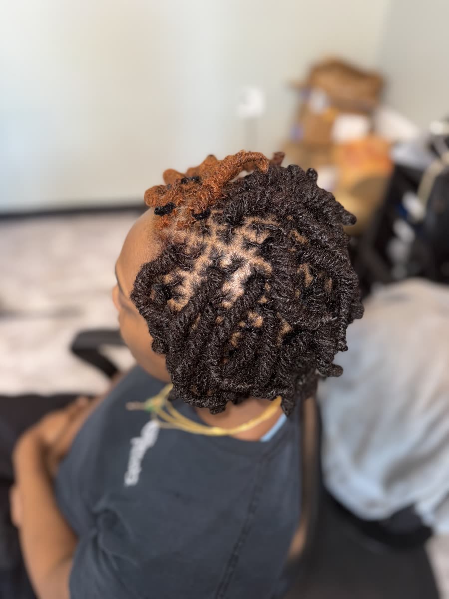 Short curly locs with color accent